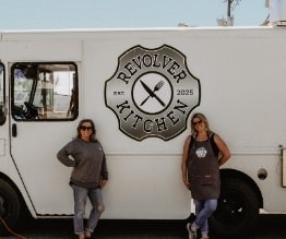 Revolver Kitchen founders in front of the truck