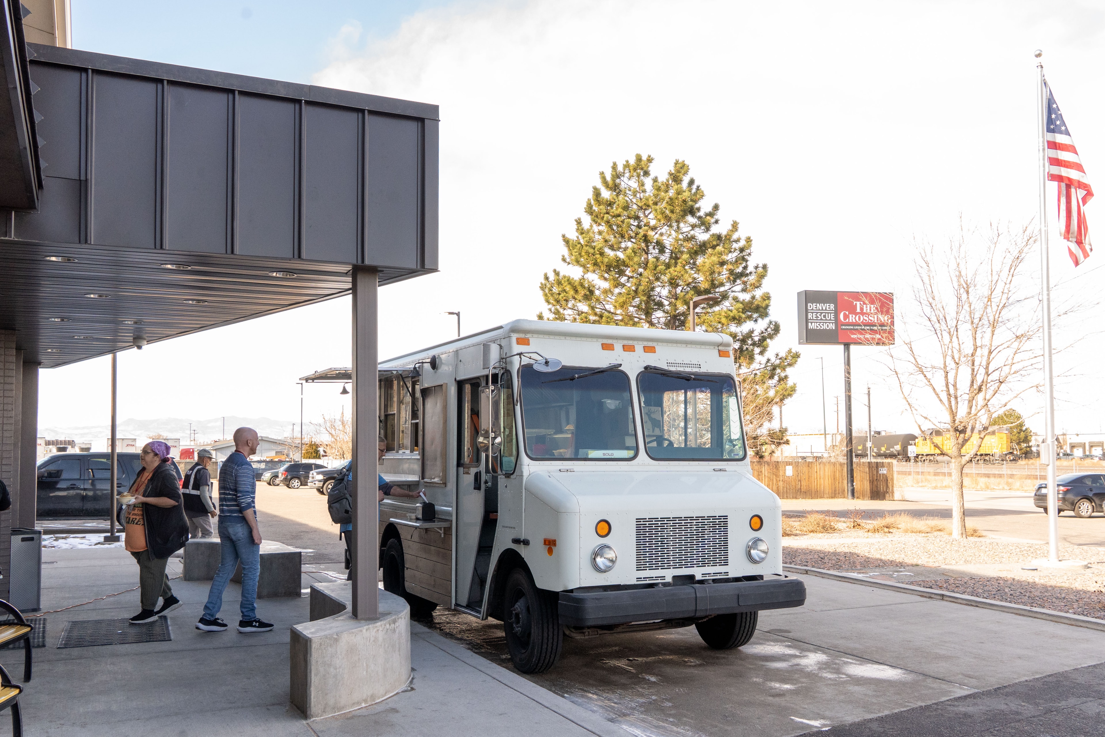 Revolver Kitchen truck parked at The Crossing with American flag