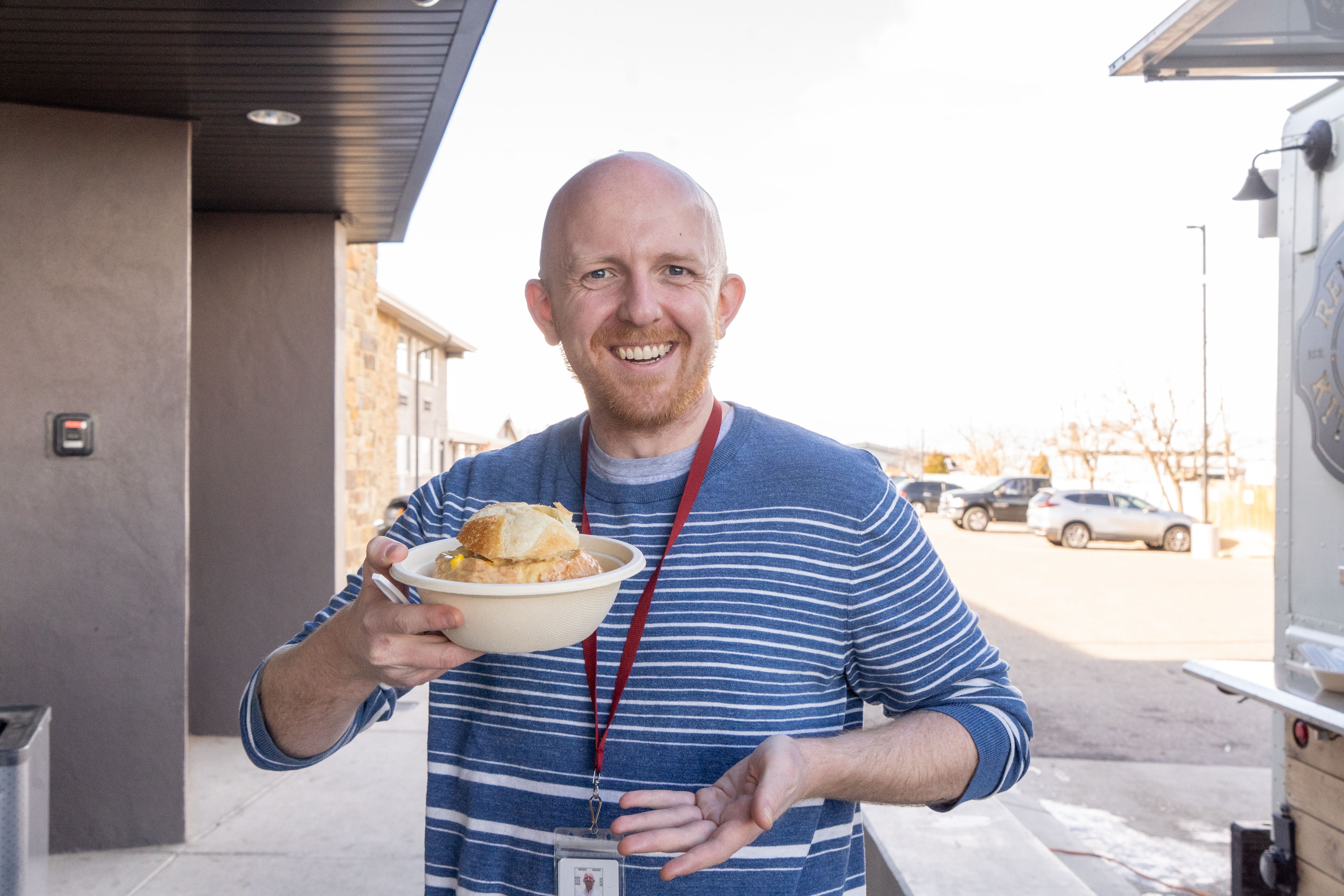Guest holding food at a Revolver Kitchen event