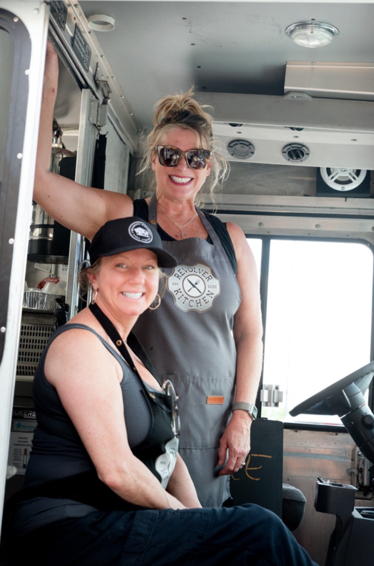 Shannon and Michelle in aprons inside the Revolver Kitchen truck