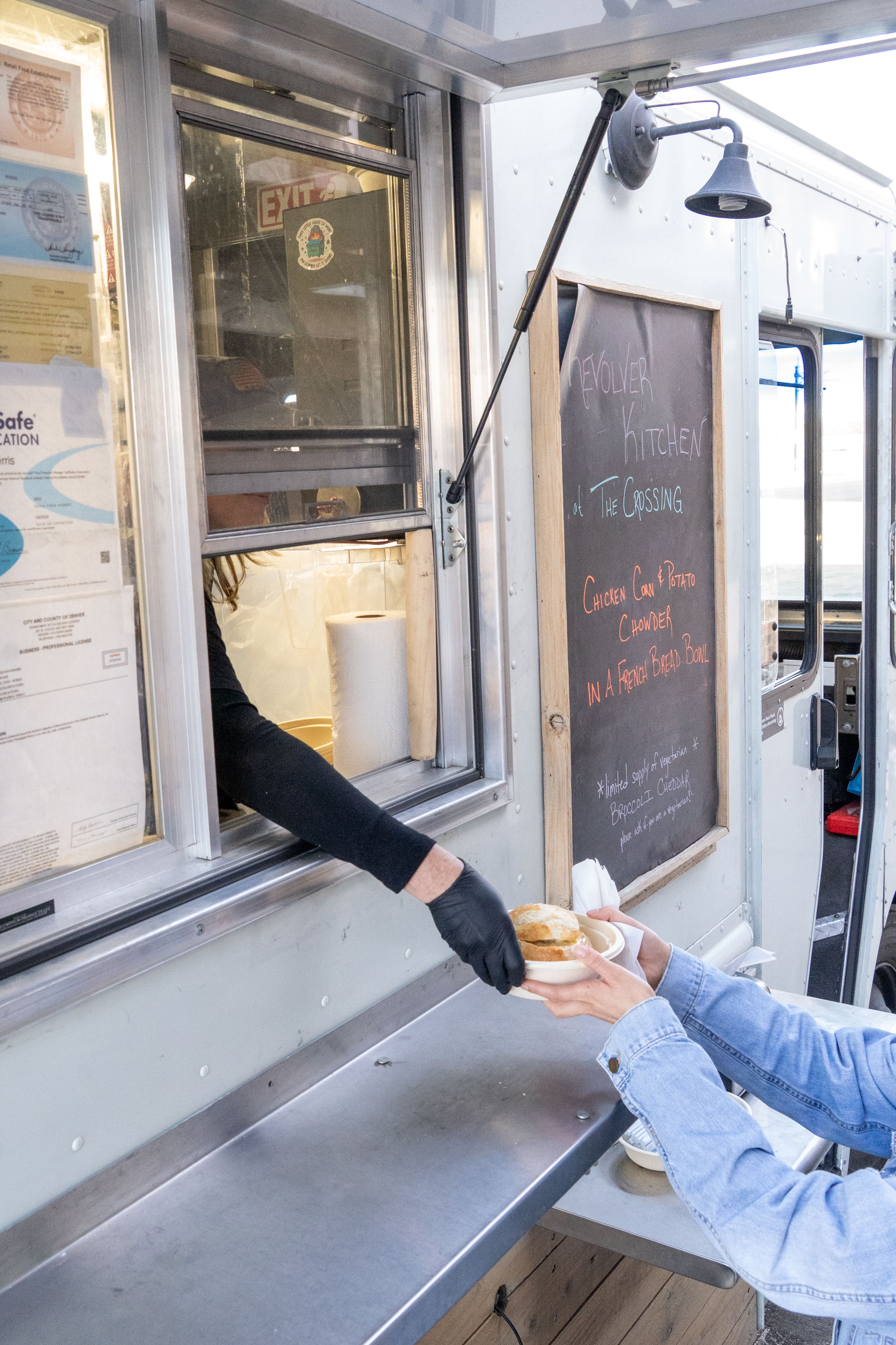 Food being handed out at the Revolver Kitchen service window