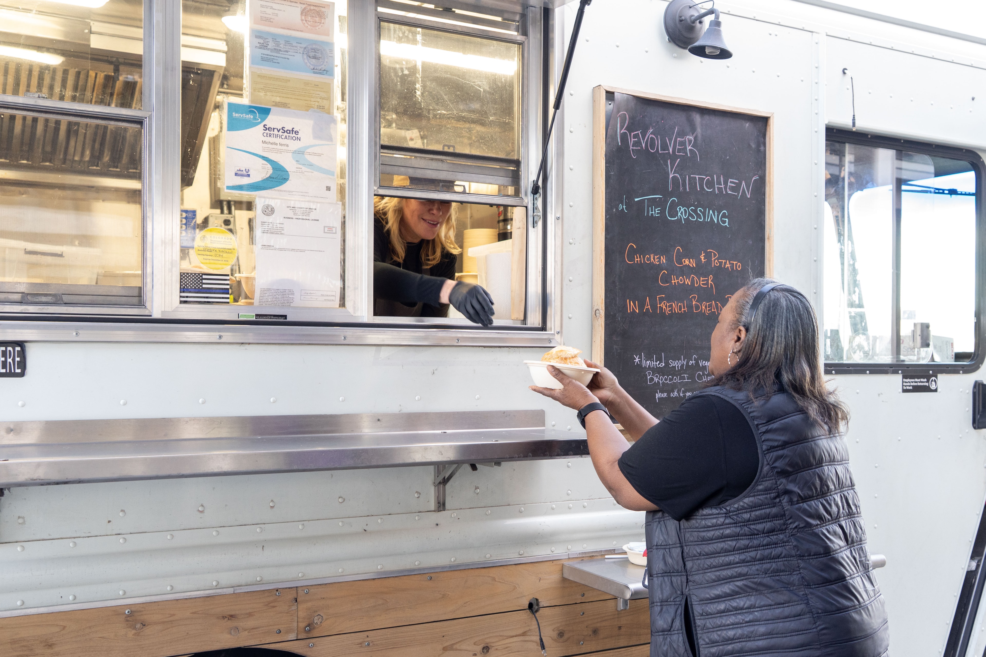 Guests ordering from the Revolver Kitchen food truck